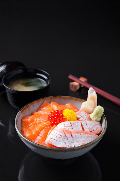 Salmon Sashimi Rice Bowl on a dark table