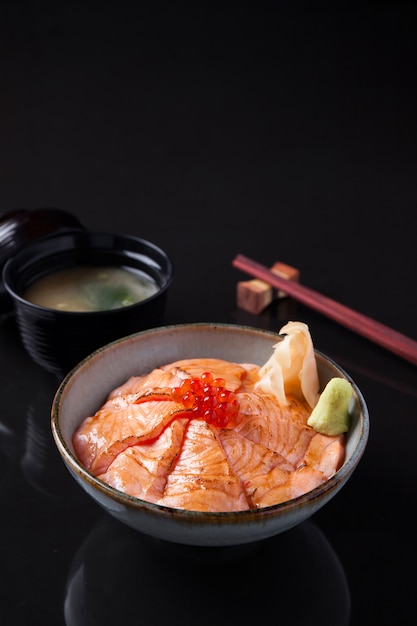 Salmon Sashimi Rice Bowl on a dark table