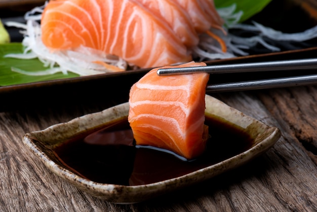 Salmon sashimi with shoyu sauce.