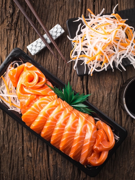 Salmon Sashimi on wooden table 