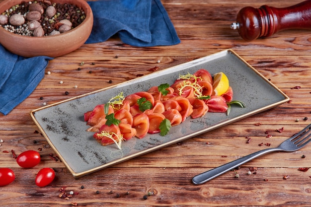 Salmon slices, snack, wooden