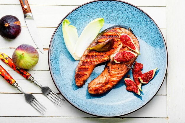 Salmon steak fried with vegetables,space for text