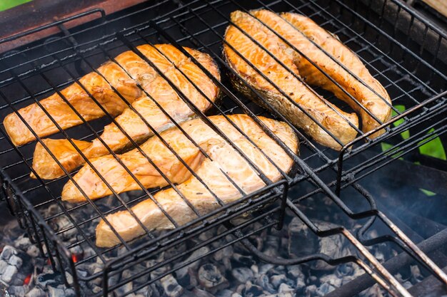 Salmon steaks on the grill. the concept of family holidays. picnic. healthy food.