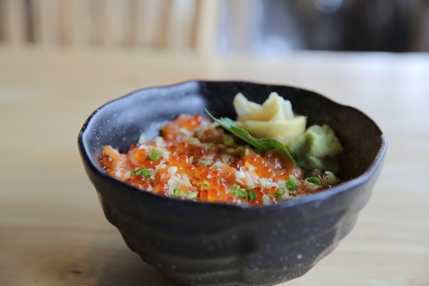 Salmon sushi don on wood background