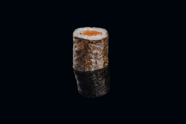 Salmon sushi wrapped with seaweed isolated.