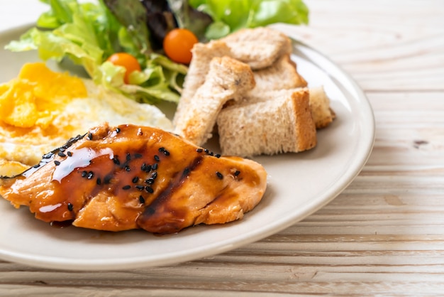 salmon teriyaki steak with fried egg and salad