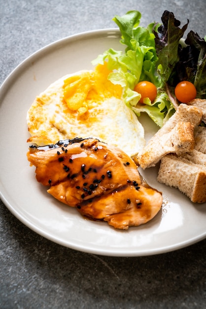 salmon teriyaki steak with fried egg and salad