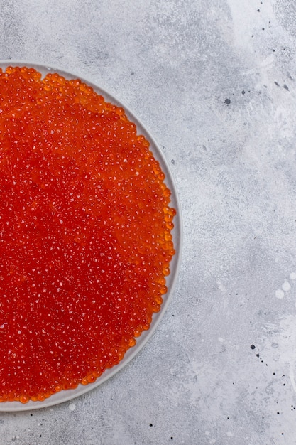 Salmon, trout red caviar. gourmet seafood. healthy food concept. light background. top view. copy space