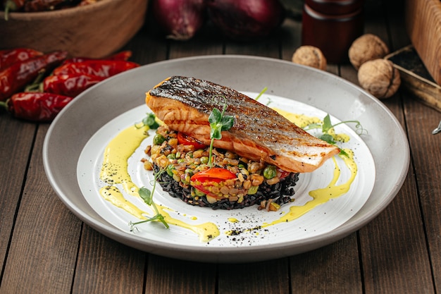 Salmon with creamy basil sauce and black rice