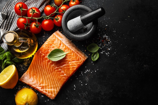 Photo salmon with ingredients on table