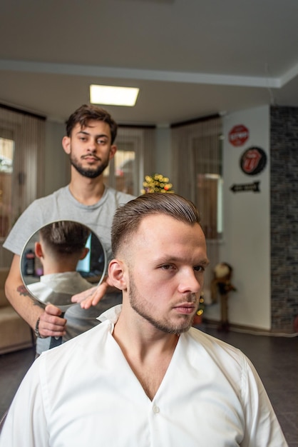 Salon Brutal man sitting in a barber chair