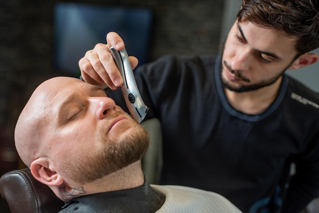 Salon Brutal man sitting in a barber chair