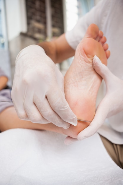 Salon worker using a scalpel