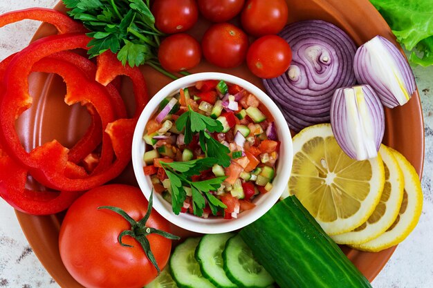 Photo salsa with ingredients on white background top view