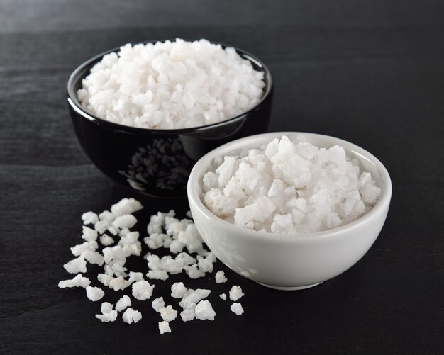 Salt in a bowl on black table