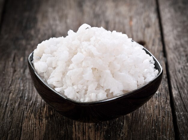 Salt crystals on wooden table