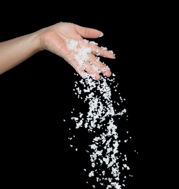 Salt flying explosion crystal white grain salts explode abstract cloud fly black background isolated