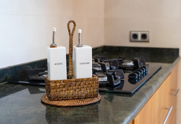 Salt and oil recipients on a kitchen next to the stoves