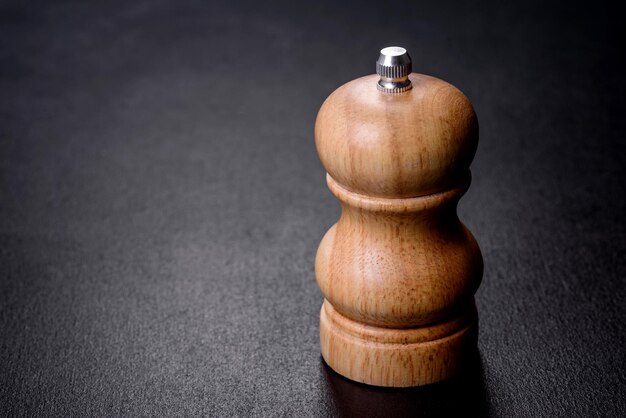 Salt or pepper shakers on black cncrete table Space for text