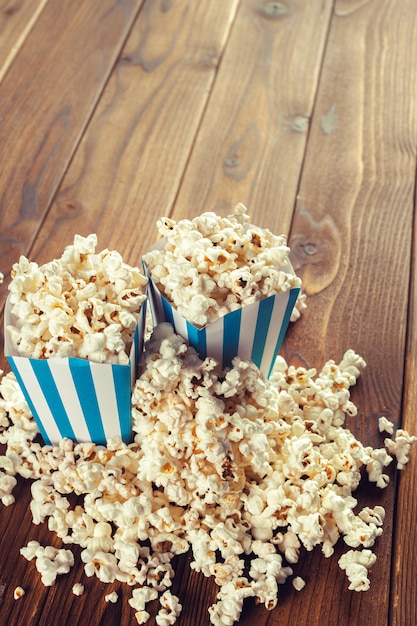 Salt popcorn on the wooden table