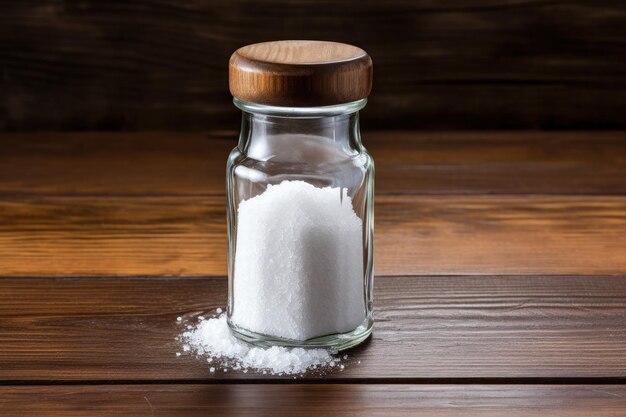 Salt shaker on wooden background