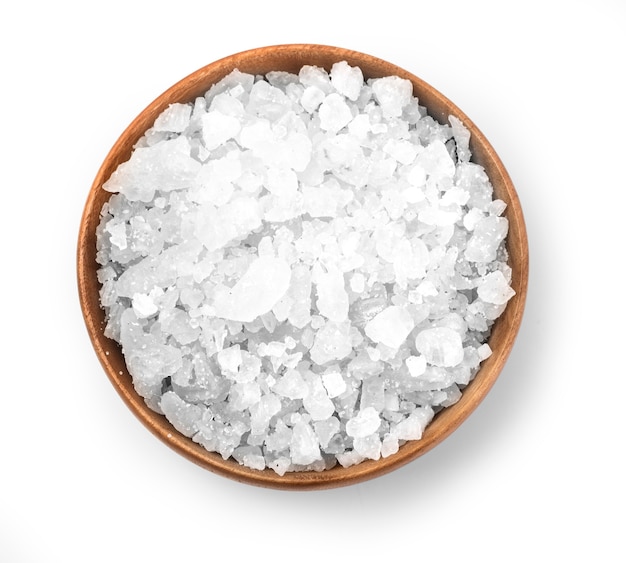 Salt in a wooden bowl isolated on white 