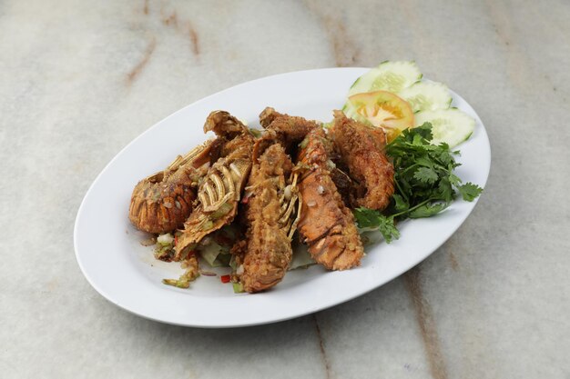 Salted and crispy crayfish serve with salad