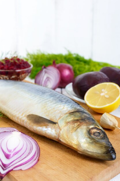 salted herring with boiled beet, red onion, garlic, lemon, dill, and rye bread