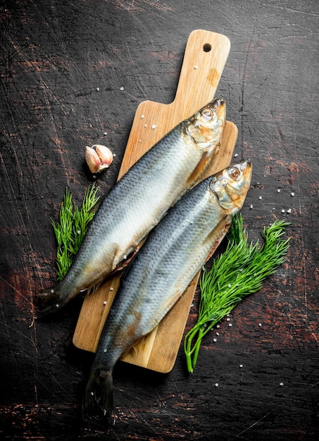 Salted herring with garlic cloves and dill