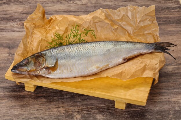 Salted herring over the wooden board