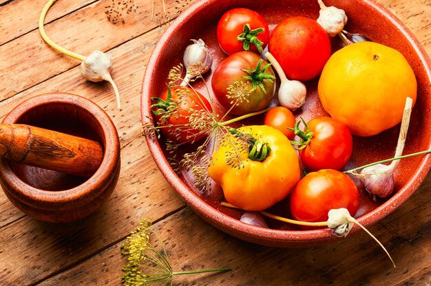 Salted homemade tomatoes.Cooking process.Canned tomato.Marinated vegetable.Preparation for pickling tomato