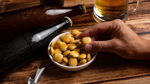 Salted Lupin Beans with beer on table