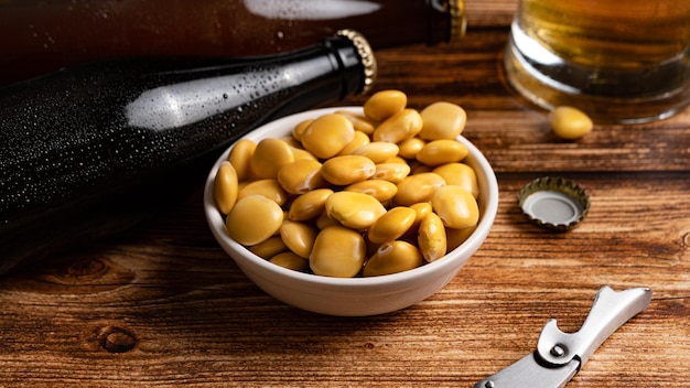 Salted Lupin Beans with beer on table