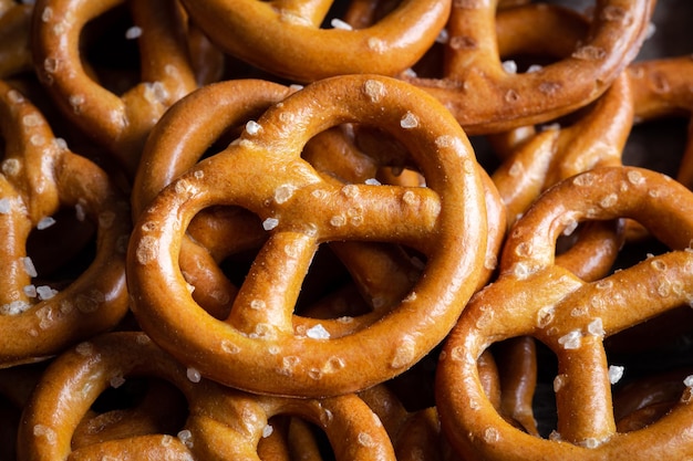 Salted mini pretzels texture background small pretzels with salt top view closeup