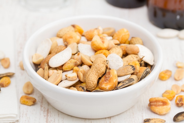 Salted nuts and seeds on white dish