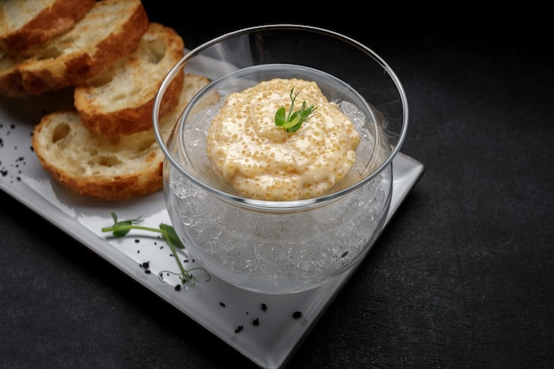 Salted pike caviar on ice with toast