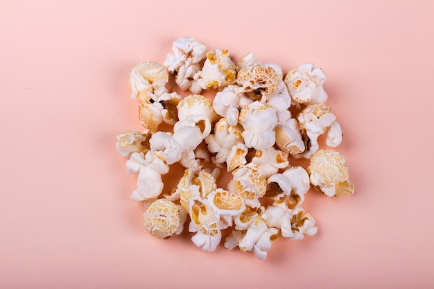 Salted popcorn on beige background