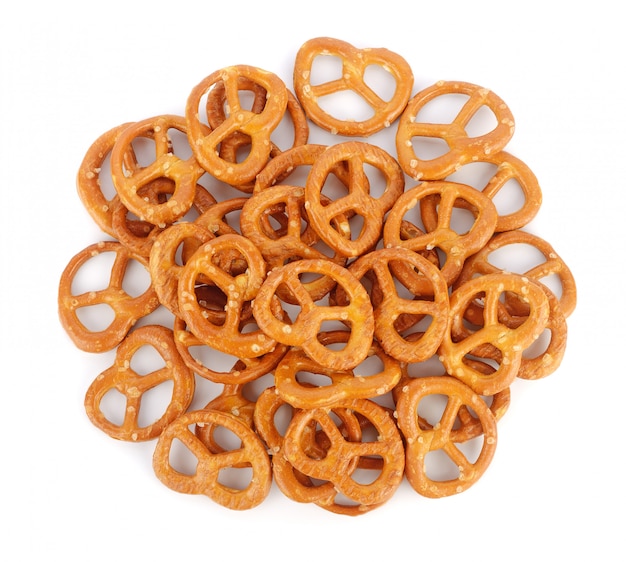 Salted pretzels on white background