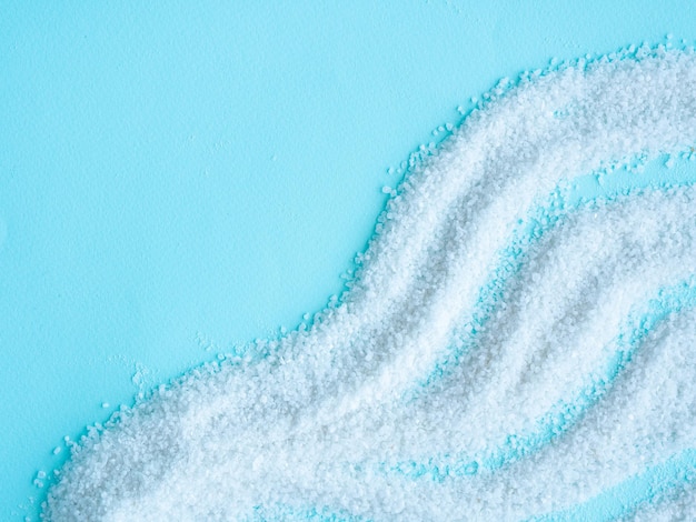 Salted salt is scattered on a blue wave