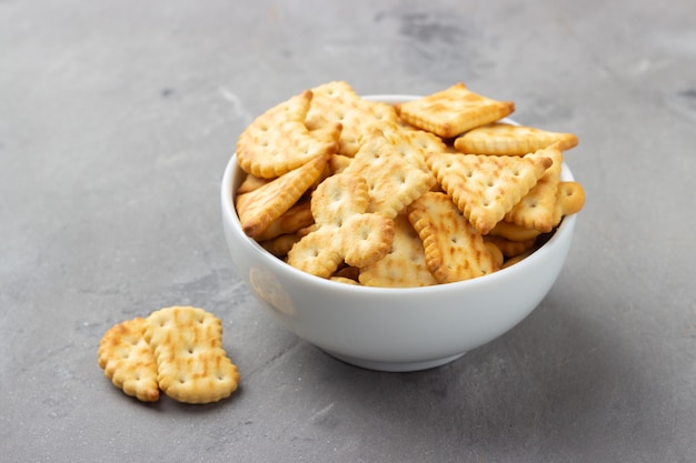 Salty crackers in bowl closeup