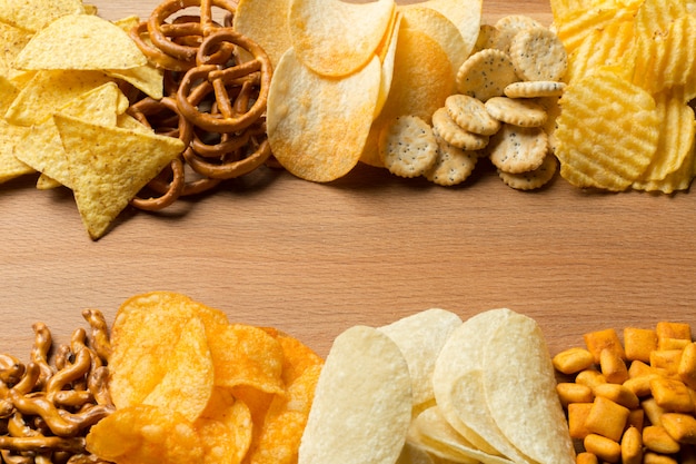 Photo salty snacks. pretzels, chips, crackers