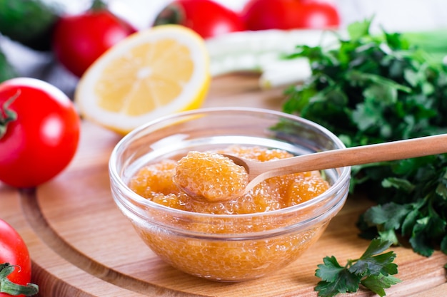 Salty yellow caviar of pike fish with spoon