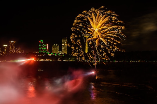 Salute, beautiful fireworks. waterfall at sunset