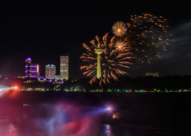 Salute, beautiful fireworks. waterfall at sunset