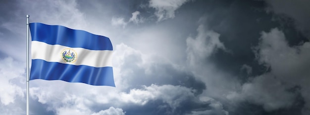 Salvadoran flag on a cloudy sky