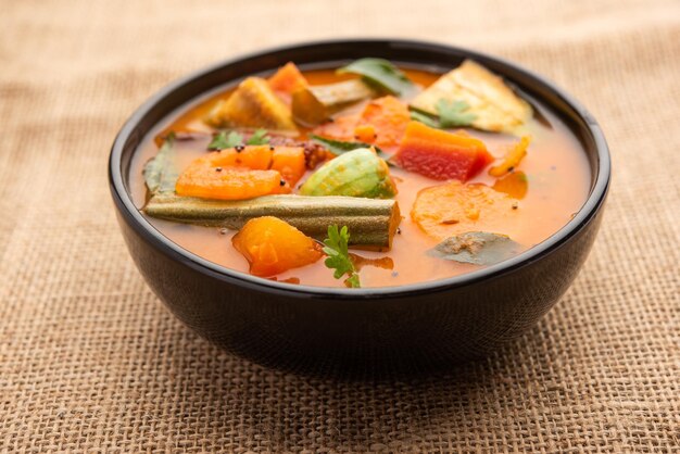 Sambar is a lentil-based vegetable stew/soup, cooked with\
pigeon pea and tamarind broth. it is popular in south indian and\
sri lankan cuisines.