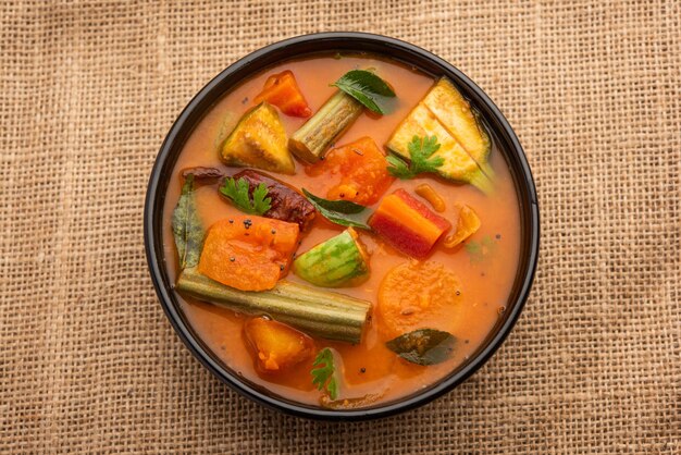 Sambar is a lentil-based vegetable stew/soup, cooked with\
pigeon pea and tamarind broth. it is popular in south indian and\
sri lankan cuisines.