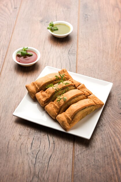 Sambar Vadi or Coriander pakora with ketchup and mint chutney