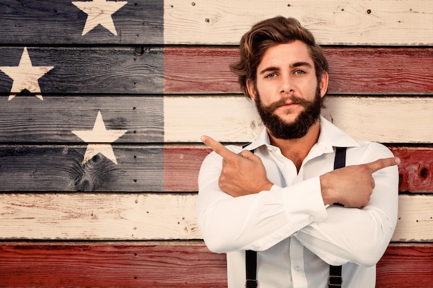 Foto samengesteld beeld van zelfverzekerde hipster die zijwaarts wijst met gekruiste armen