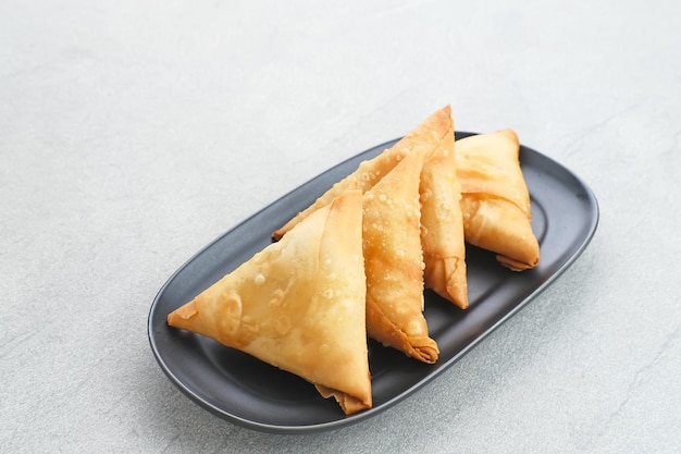 Samosa Keju a crispy triangle fried pastry snack with cheese filling